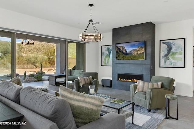 living room featuring a fireplace and an inviting chandelier