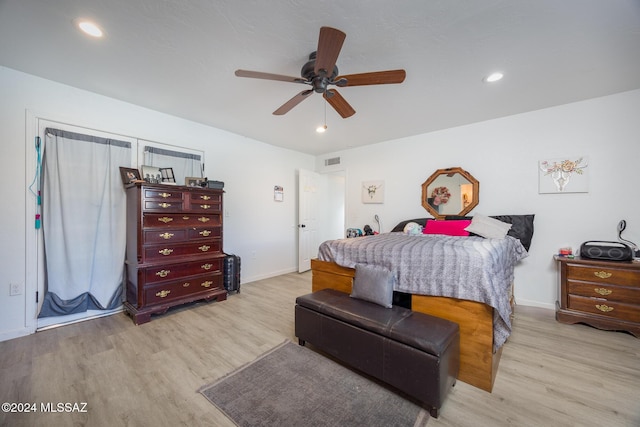 bedroom featuring light wood-type flooring and ceiling fan