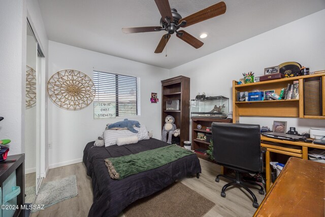 bedroom featuring ceiling fan and light hardwood / wood-style floors