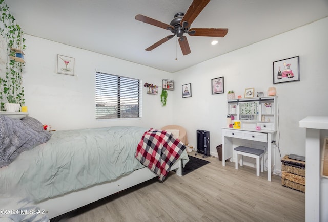 bedroom featuring light wood-type flooring and ceiling fan