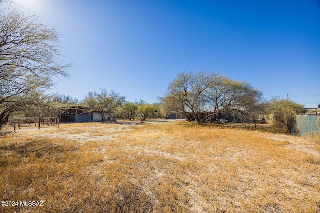 view of yard with a rural view