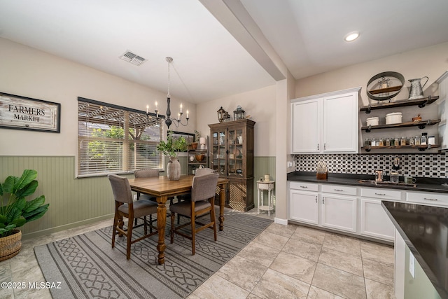 dining room featuring a chandelier