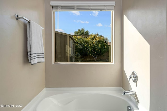 bathroom featuring a tub to relax in