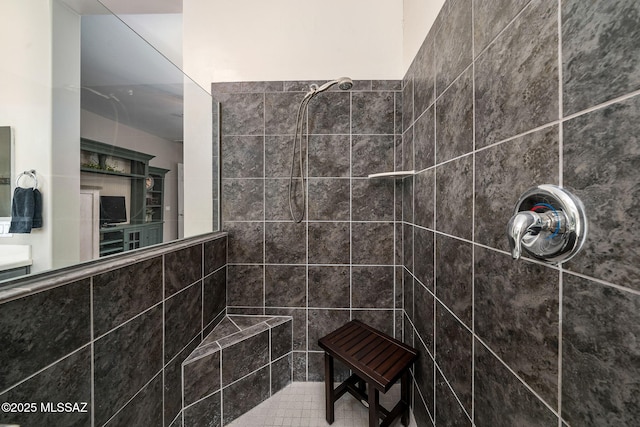 bathroom with tiled shower