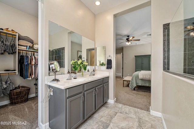 bathroom featuring vanity and ceiling fan