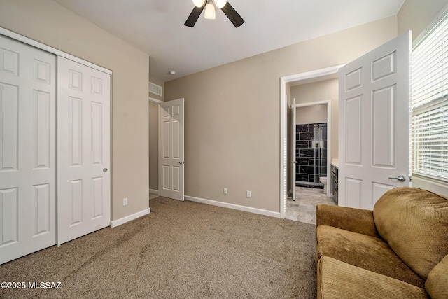 sitting room featuring light carpet, a wealth of natural light, and ceiling fan