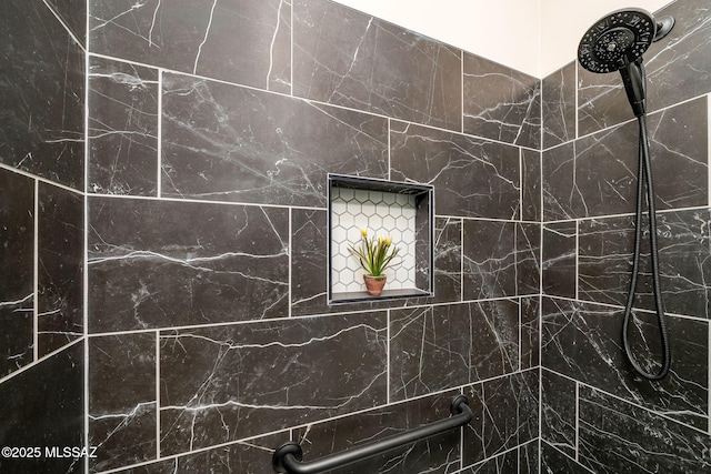 bathroom with tiled shower