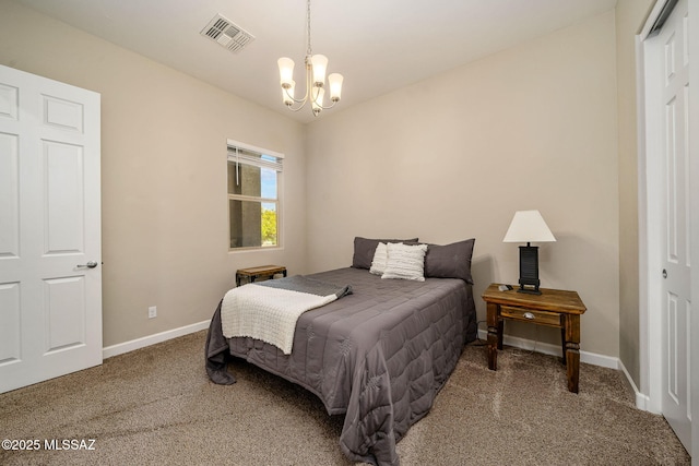 carpeted bedroom featuring a closet and a notable chandelier