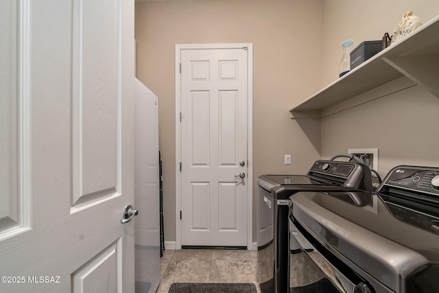 laundry area with independent washer and dryer