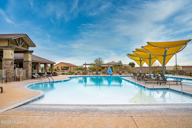 view of swimming pool with a patio area