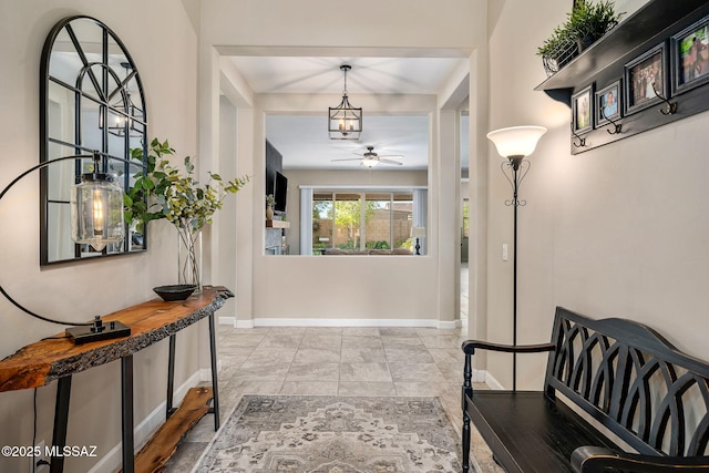 entrance foyer featuring ceiling fan