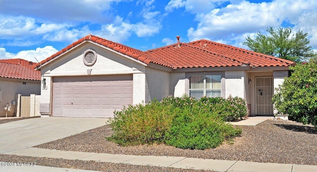 mediterranean / spanish-style home featuring a garage