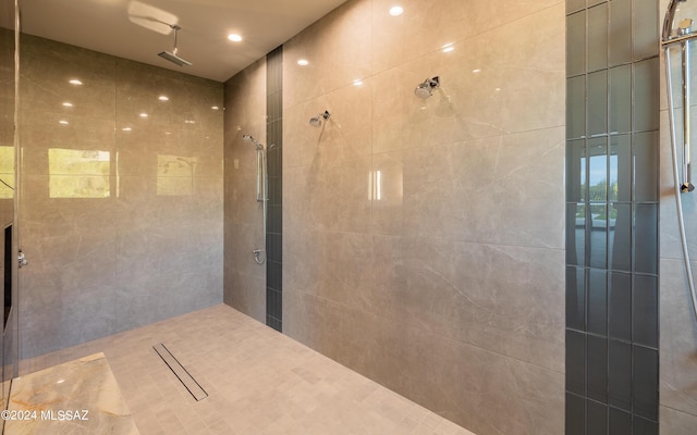 bathroom with tiled shower