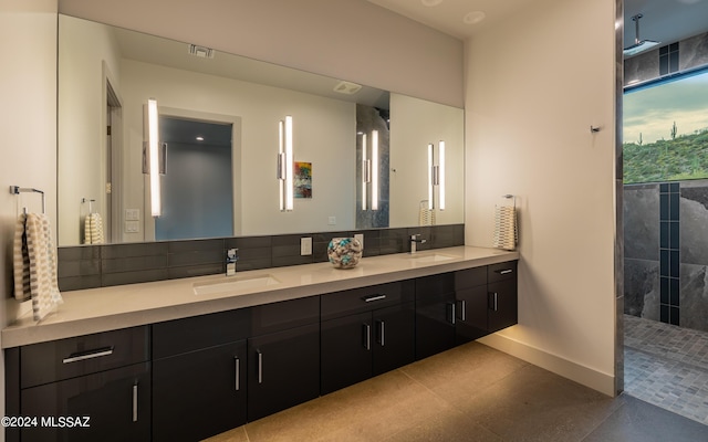 bathroom with a shower and vanity