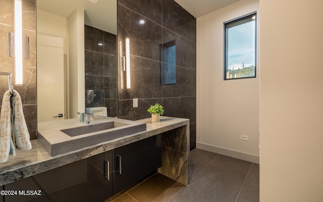 bathroom with vanity, tile walls, and tile patterned floors