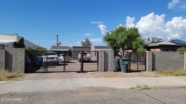 view of gate featuring central AC