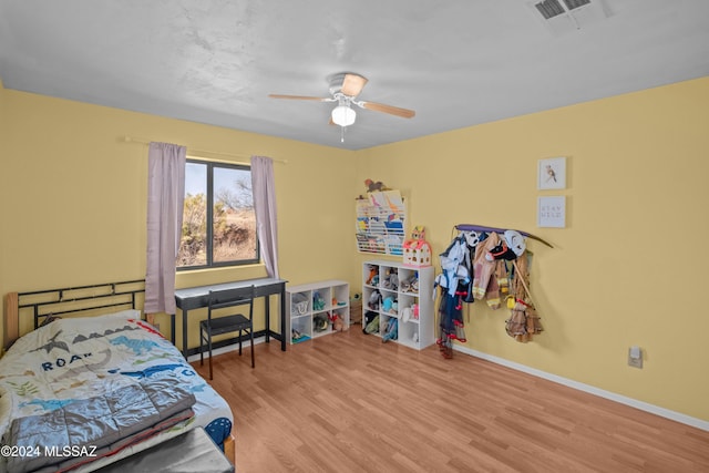 bedroom featuring light hardwood / wood-style floors and ceiling fan