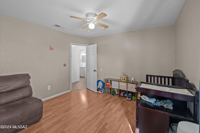 bedroom featuring light wood-type flooring and ceiling fan