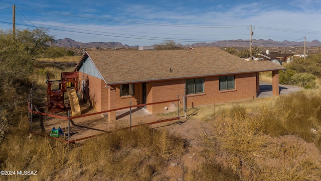 back of house featuring a mountain view