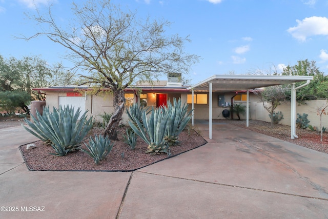 view of front of home featuring a carport