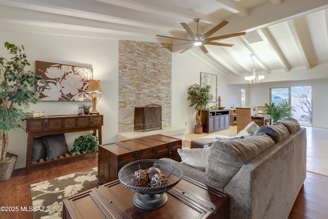 living room with hardwood / wood-style floors, lofted ceiling with beams, a fireplace, and ceiling fan with notable chandelier