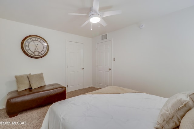 bedroom featuring ceiling fan and carpet