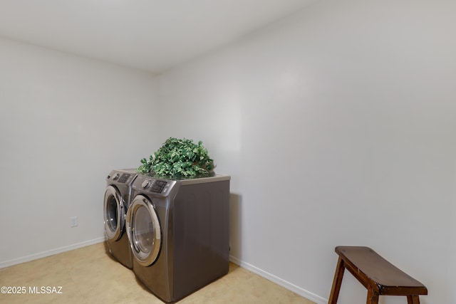 laundry room with washing machine and dryer