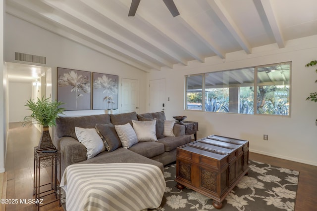 living room with hardwood / wood-style flooring, vaulted ceiling with beams, and ceiling fan