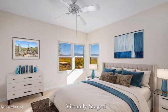 bedroom featuring ceiling fan and carpet floors