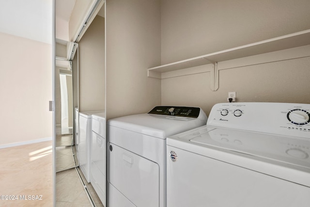 washroom with washing machine and dryer