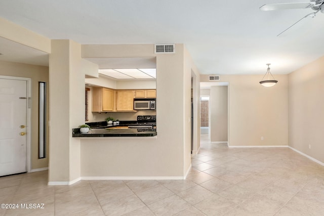 kitchen featuring pendant lighting, electric range, ceiling fan, light tile patterned floors, and light brown cabinetry