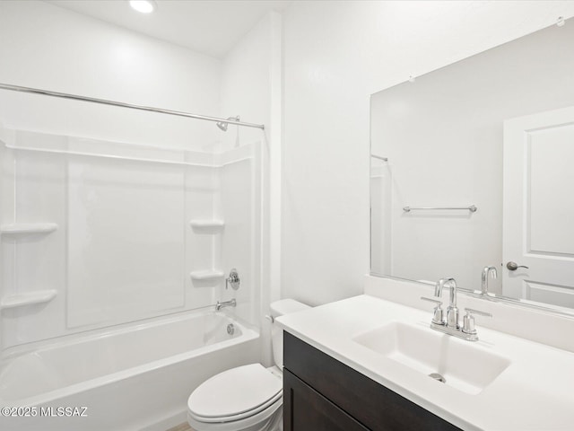 bathroom featuring toilet, washtub / shower combination, and vanity