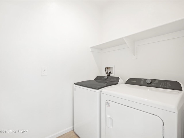 laundry room featuring laundry area, independent washer and dryer, and baseboards