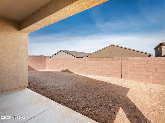 view of yard with a fenced backyard