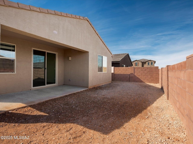 view of yard with a fenced backyard and a patio