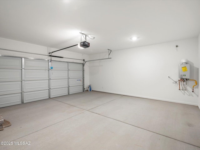 garage featuring a garage door opener and baseboards