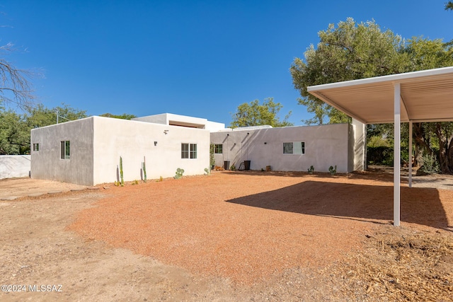 back of property with stucco siding