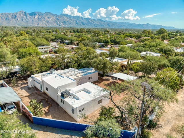 birds eye view of property with a mountain view