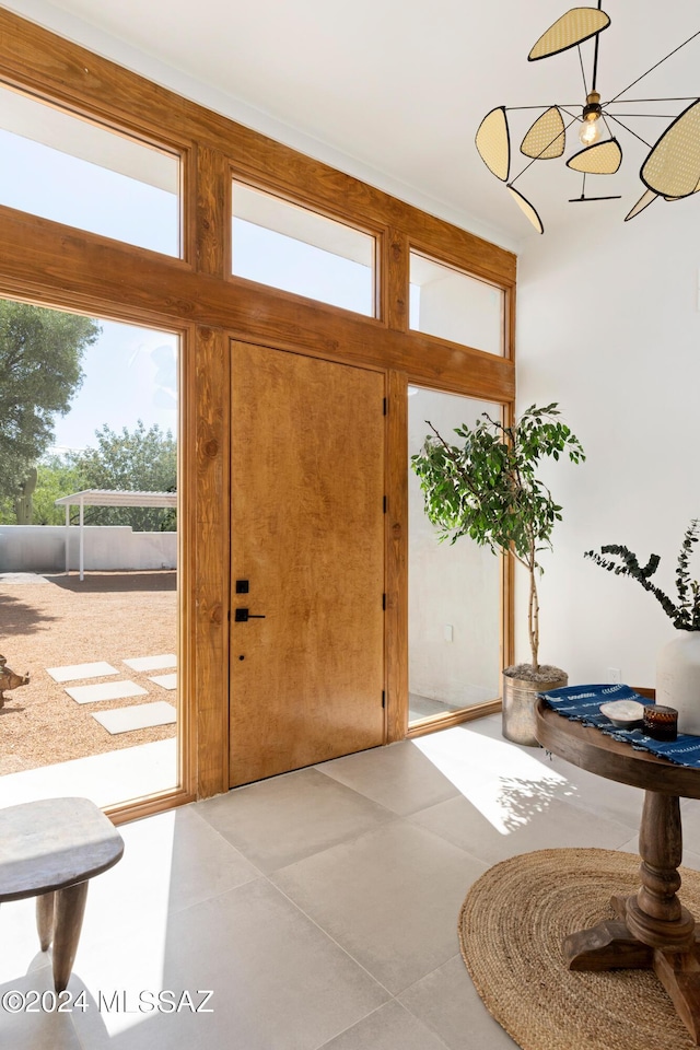 foyer entrance with light tile patterned floors