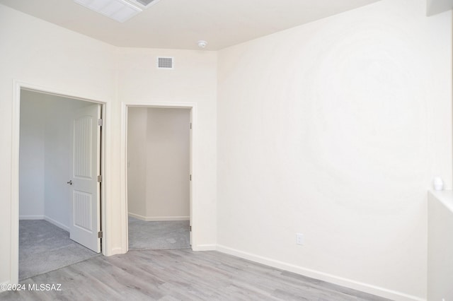 spare room with light hardwood / wood-style floors