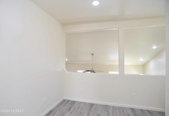 unfurnished room with ceiling fan and light hardwood / wood-style floors