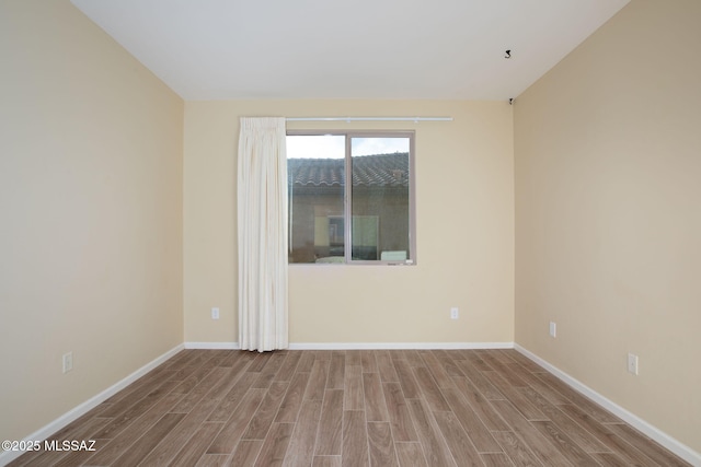 spare room with light hardwood / wood-style floors