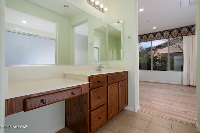 bathroom with tile patterned flooring and vanity