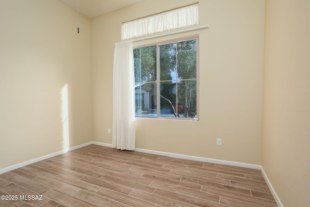 spare room featuring light wood-type flooring