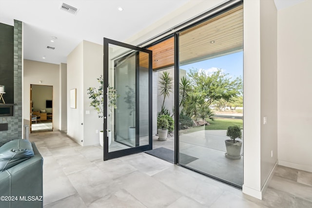 doorway with french doors and floor to ceiling windows