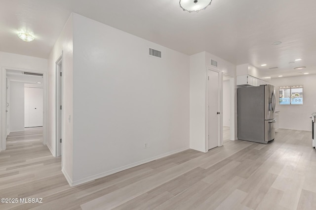 unfurnished living room with light hardwood / wood-style floors