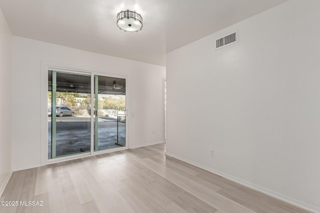 unfurnished room with light hardwood / wood-style flooring