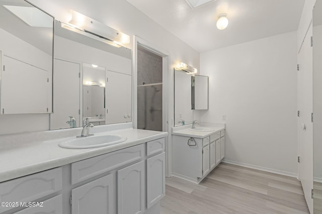 bathroom with hardwood / wood-style floors and vanity