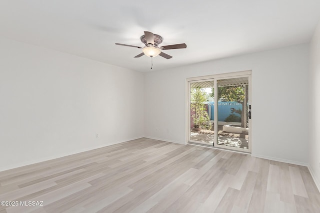 empty room with light wood-type flooring and ceiling fan