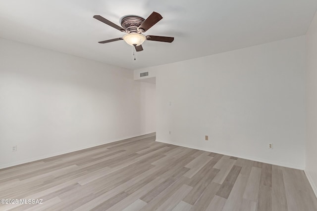 spare room with ceiling fan and light hardwood / wood-style flooring